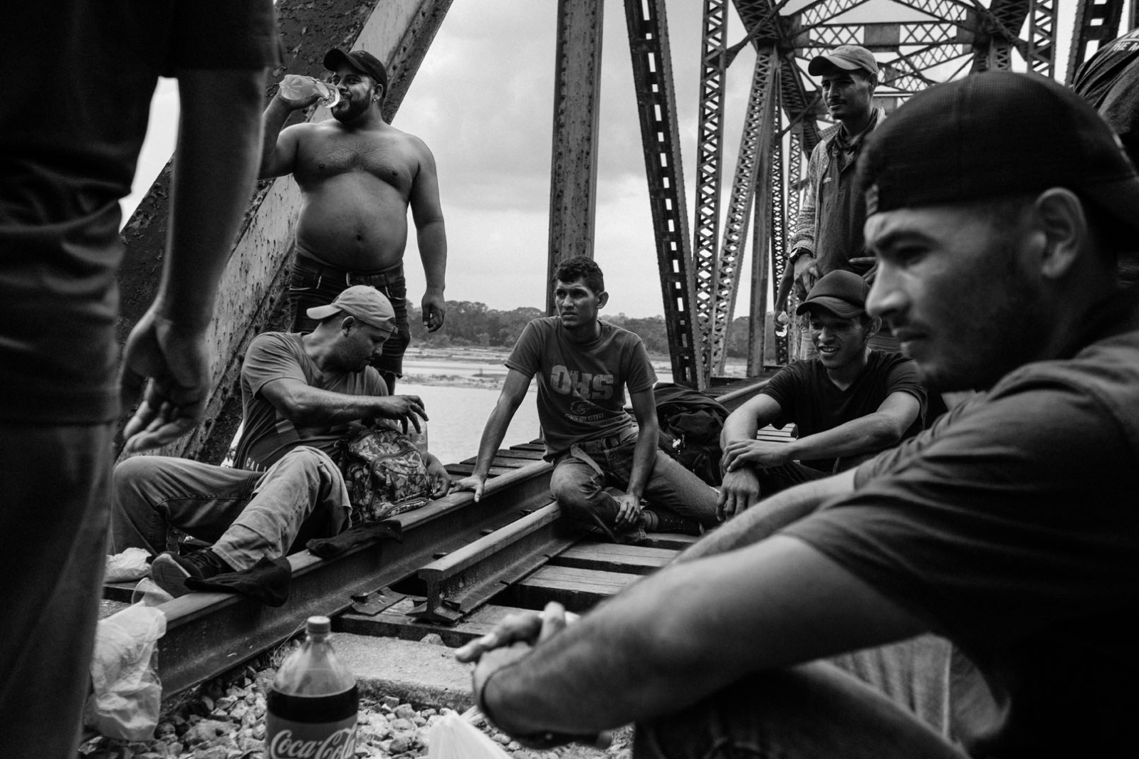 People from Honduras rest on a bridge along a migration route in San Manuel, Tabasco, Mexico, on March 6, 2021.
In 2021 the photographer started a seven-month journey along the migration routes of Central America, Mexico, and the United States as part of an investigation on the migrations across the American continent. 
In the Mexican states of Chiapas, Tabasco, and Veracruz, the work was possible thanks to the support of Mexican activists who monitored the routes people pace on their northward journey, assisting them with food and medicines.