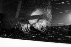 A man looks out from the window of a Customs and Border Protection vehicle as he is taken into custody for entering the United States illegally and guiding a group of migrants through the border in La Joya, Texas, on June 6, 2021.
Between May and July 2021, the photographer has documented the crossing of refugees and migrants in the United States, focusing on Del Rio, Roma, and La Joya border towns in Texas, and finding out that so many Venezuelans who had first migrated to Colombia were now trying to reach the United States with people of other nationalities. 
While documenting the Customs and Border Protection operations, the photographer asked the people apprehended their permission to photograph.
