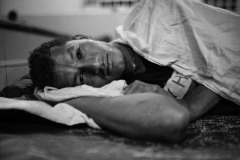 A man lies down in a charity shelter in Tenosique, Mexico, on March 8, 2021.
The shelter, active since 2011, was named The 72, in memory of 72 people from Central and South America killed by a Mexican cartel while trying to cross into the United States from the bordering Tamaulipas state on August 24, 2010.
The Tamaulipas massacre occurred 150km from the Northern border. The kidnappers shot people in the back and piled them up exposed to the weather when they refused to work for the cartel.
Mexican authorities revealed that two people survived. Among them, an Ecuatorian shot in the jaw faked his death not to be shot again.
By 2021, nine bodies remain not identified, and the crime with impunity.
The photographer visited the shelters several times in 2021, and worked with the assistance of The 72’s professionals to avoid photographs of people whose visibility would have put lives at risk.
In 2021, the number of refugees and migrants needing a safe place at night aroused beyond the shelter capacity. The chapel, adorned with 72 crosses on the main wall, was converted into a dormitory. A man lies down in a charity shelter in Tenosique, Mexico, on March 8, 2021.
The shelter, active since 2011, was named The 72, in memory of 72 people from Central and South America killed by a Mexican cartel while trying to cross into the United States from the bordering Tamaulipas state on August 24, 2010.
The Tamaulipas massacre occurred 150km from the Northern border. The kidnappers shot people in the back and piled them up exposed to the weather when they refused to work for the cartel.
Mexican authorities revealed that two people survived. Among them, an Ecuatorian shot in the jaw faked his death not to be shot again.
By 2021, nine bodies remain not identified, and the crime with impunity.
The photographer visited the shelters several times in 2021, and worked with the assistance of The 72’s professionals to avoid photographs of people whose visibility would have put lives at risk.
In 2021, the number of refugees and migrants needing a safe place at night aroused beyond the shelter capacity. The chapel, adorned with 72 crosses on the main wall, was converted into a dormitory.