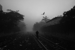 A railway officer walks along tracks in Coatzacoalcos, Mexico, on February 17, 2021. Migrants sometimes try to jump aboard a cargo train known as The Beast to head north. There, the risk of kidnapping and assaults makes the path dangerous. A railway officer walks along tracks in Coatzacoalcos, Mexico, on February 17, 2021. Migrants sometimes try to jump aboard a cargo train known as The Beast to head north. There, the risk of kidnapping and assaults makes the path dangerous.