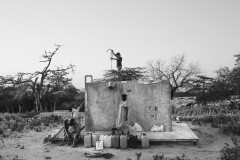 People from the community access water from a tank filled with potable water by a Bogotá based NGO.