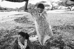 Wayuu women rest after preparing food during a funeral.