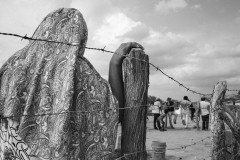 A woman stands during the funeral of a 2 years old baby who died from sudden fever. Epidemics of fever have increased among Wayuu children since the rain started to fall again after four years of severe drought, in 2016.